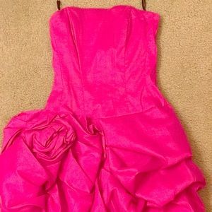 Pink dress with ruffled detailing.